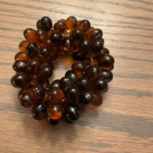 Amber colored stretch bracelet.  Plastic Beads.  Approx 8”
